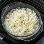Perfect air fryer rice in a glass bowl.