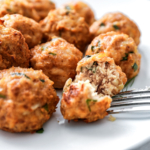 Air fryer chicken meatballs on a white plate.
