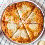 Air fryer frozen pizza on a white plate.