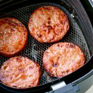 Air fried ham steaks in an air fryer.