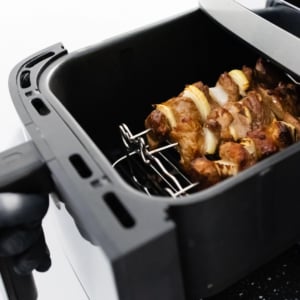 Skewer rack in an air fryer basket.