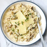 Instant Pot mushroom risotto in a white bowl.