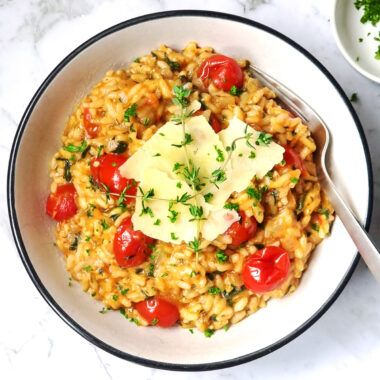 Instant Pot tomato risotto in a white bowl.