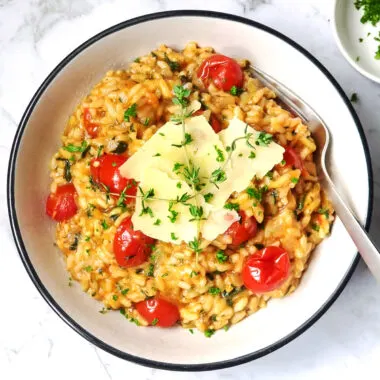 Instant Pot tomato risotto in a white bowl.