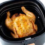 Roast chicken in air fryer basket.