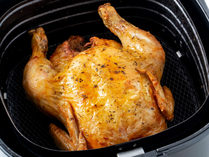 Roast chicken in air fryer basket.