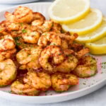 Air fryer shrimp on a grey plate.
