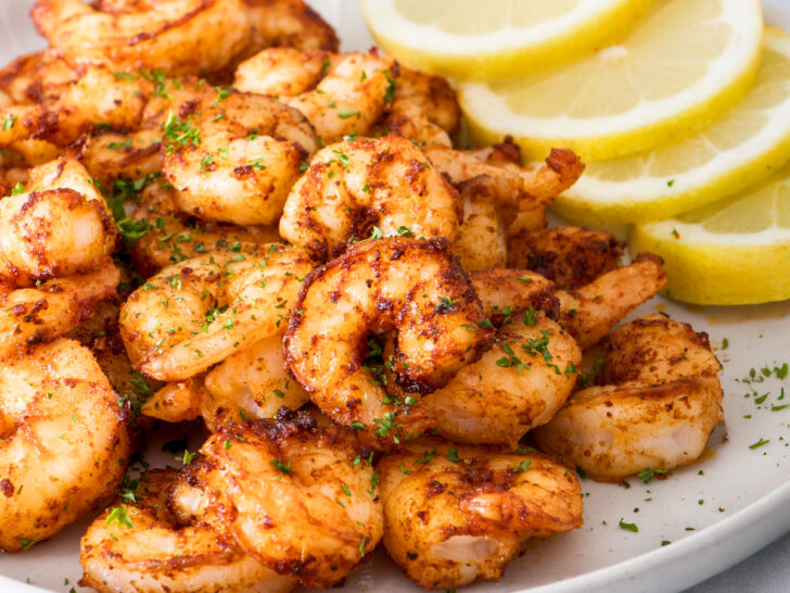 Air fryer shrimp on a grey plate.