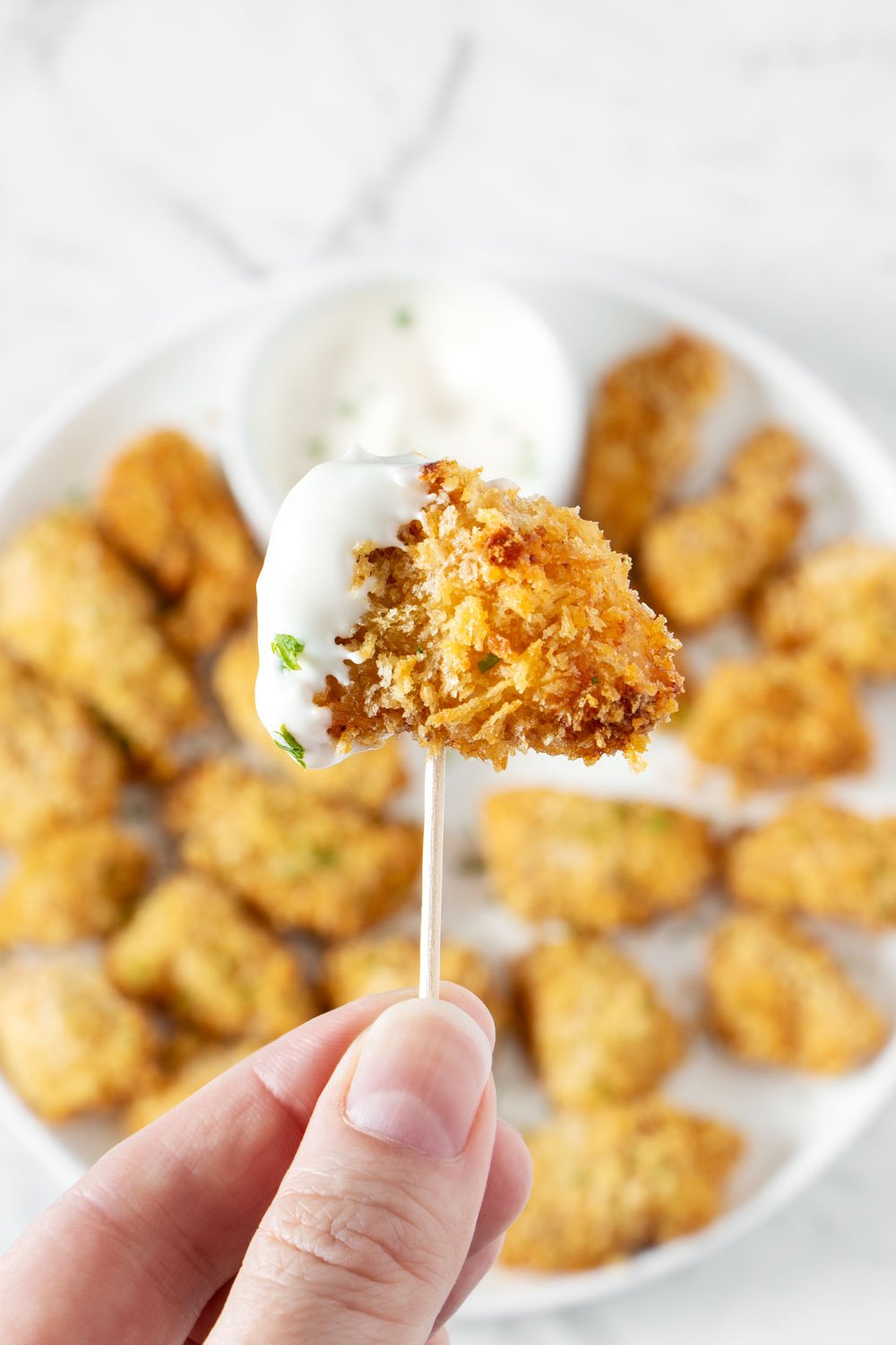 A piece of air fried popcorn chicken.