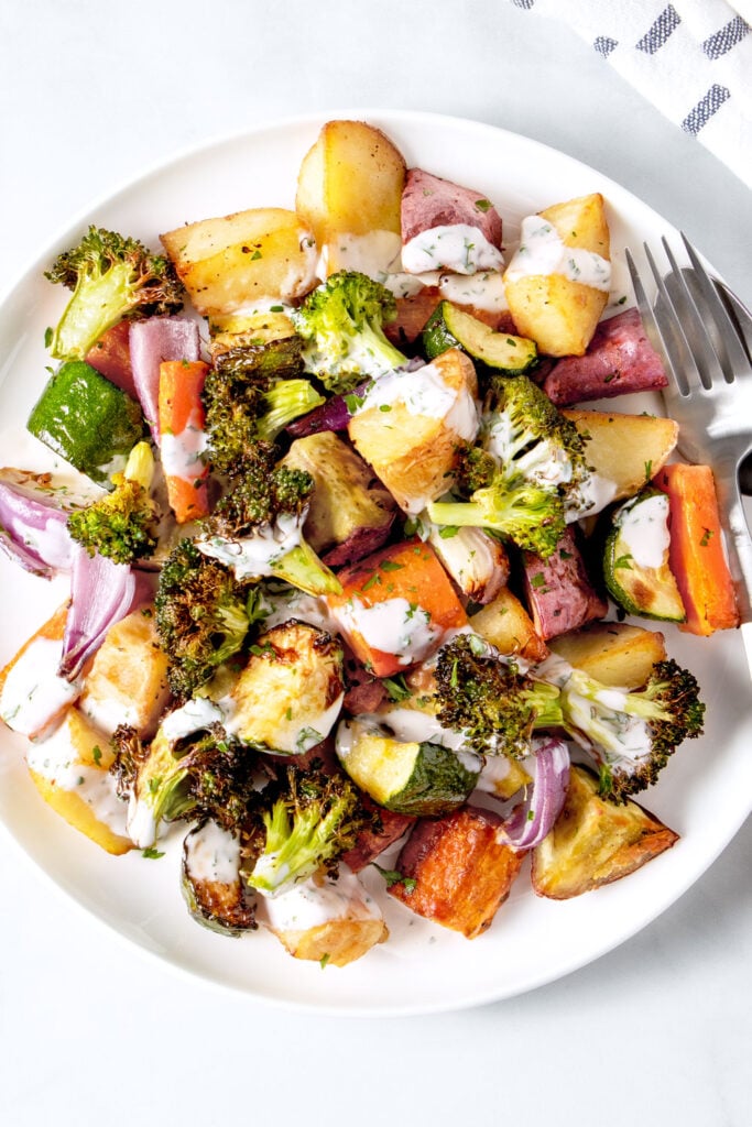 Air fryer roasted vegetables on a white plate.