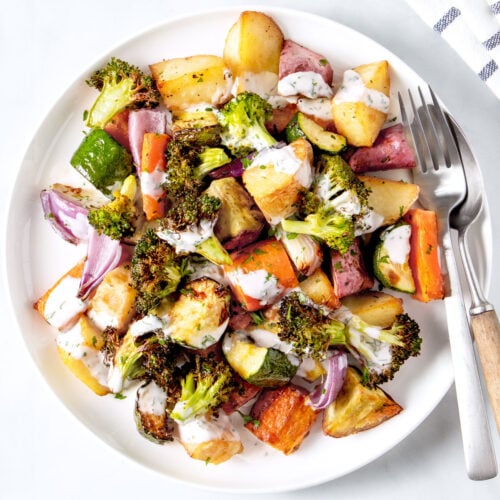 Air fryer roasted vegetables on a white plate.