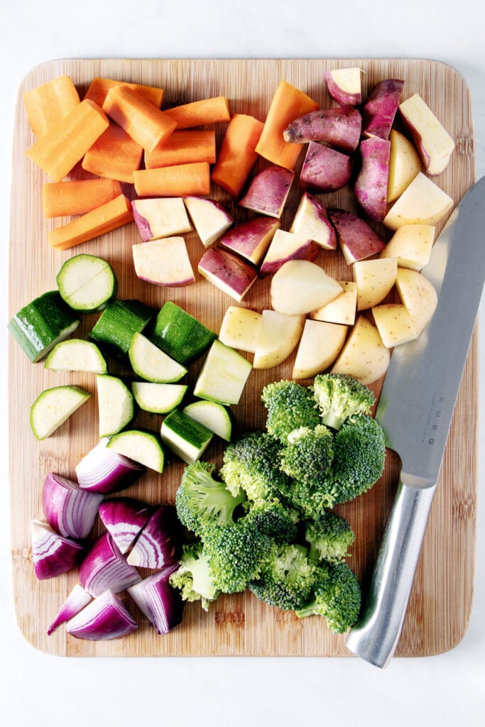Chopped vegetables on a wooden board.