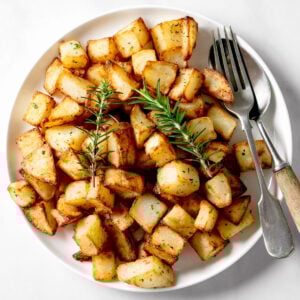 Air fryer Parmentier potatoes on a white plate.
