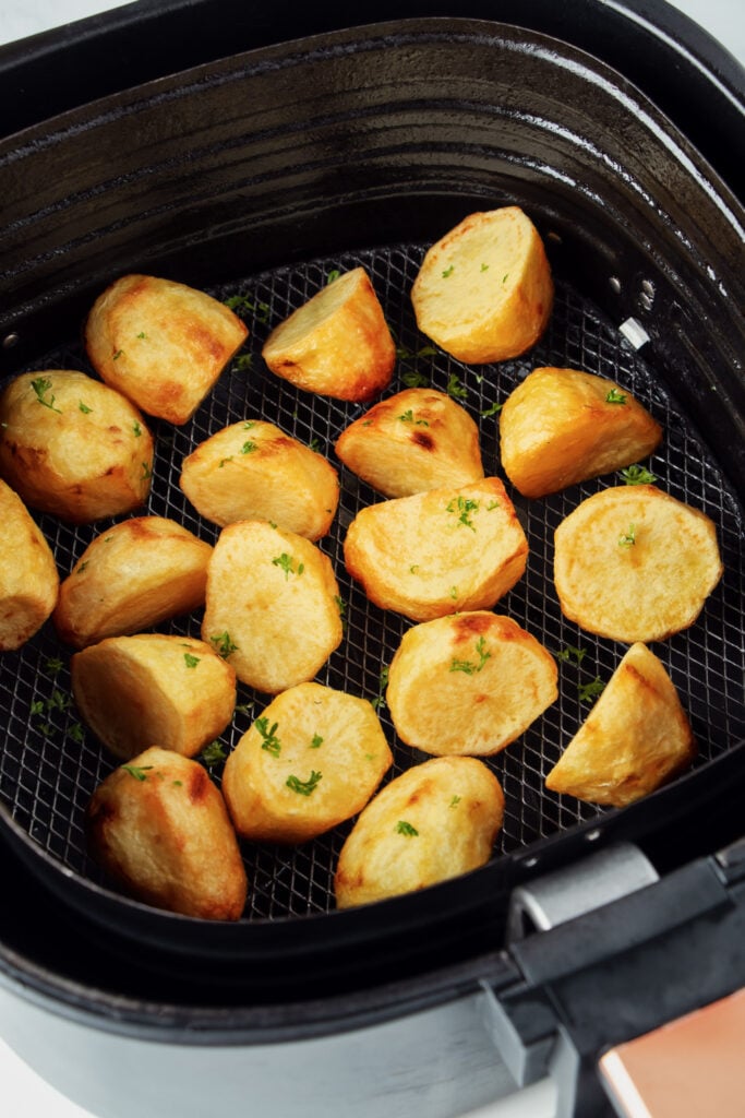 Roast potatoes in air fryer basket.