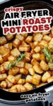 Crispy, golden mini roast potatoes on a white plate with text overlay: air fryer mini roast potatoes.